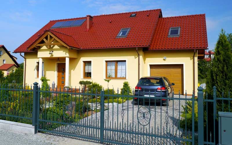 Yellow residential dwelling with red roof in Poland