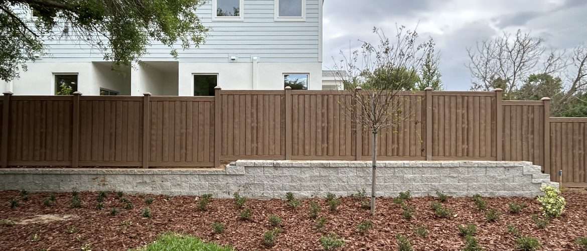 a vertical brown simtek fence